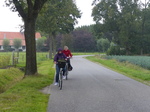 FZ008450 Jenni and Machteld biking in the rain.jpg